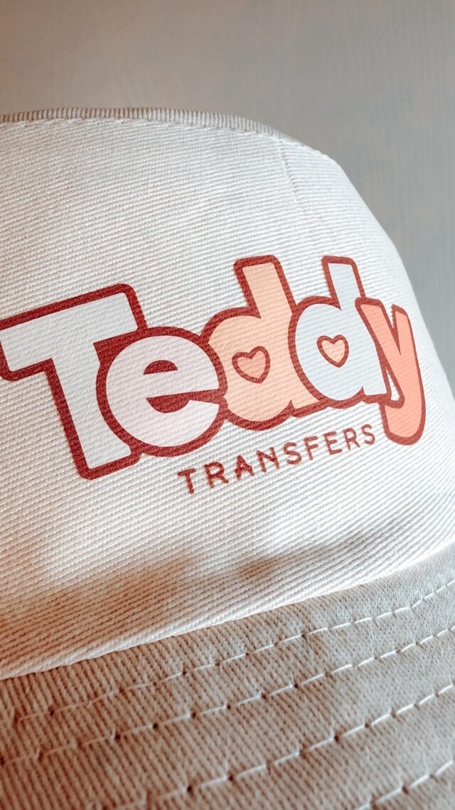 DTF transfer: Pressing a clean DTF transfer onto this hat Crisp detail, smooth finish, and built to last. This is why I love DTF—no weeding, just press and go. Who’s adding c